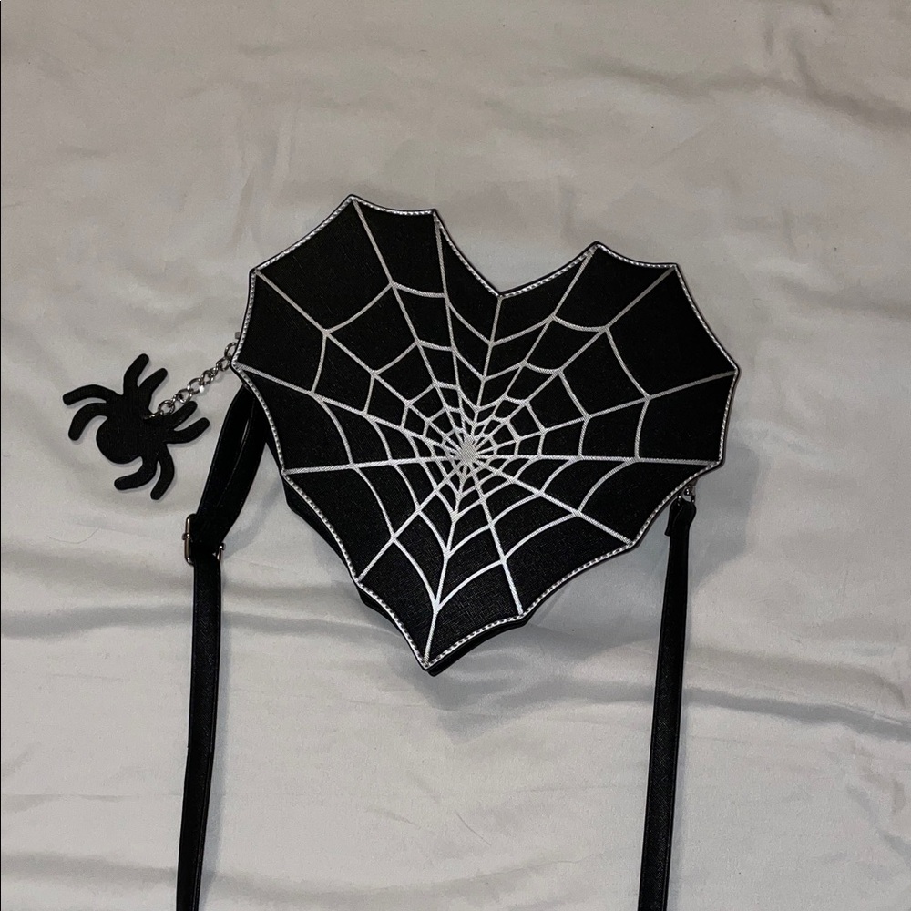 Spiderweb heart shaped cross body bag